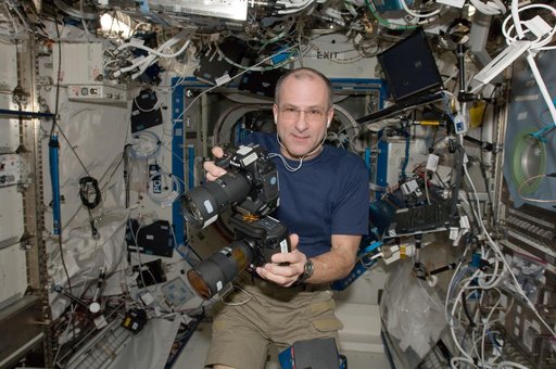 Pettit holds cameras in the U.S. Laboratory