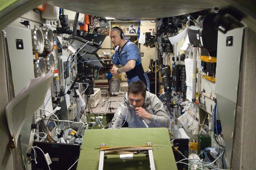 Expedition 30 Crewmembers Monitor Data in the SM during Approach