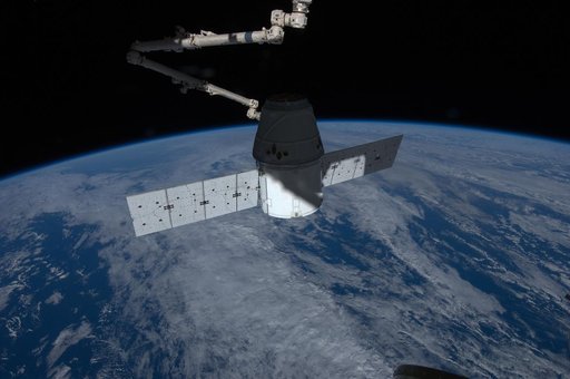 Dragon Spacecraft grappled by SSRMS during Installation OPS