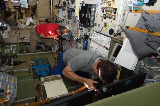 Crew Members photograph the Progress 47P Undocking