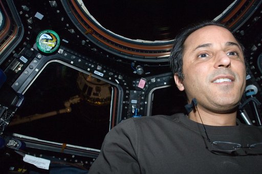 Expedition 32 FE Acaba poses for a photo in the Cupola