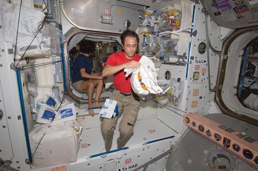 Expedition 32 Crew Members working in the Node 1