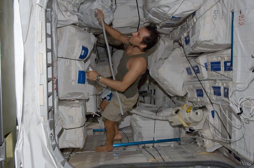 Expedition 32 FE Acaba vacuums in the PMM