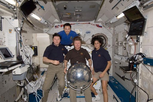 ISS032 crewmembers with Sfera satellite in JPM