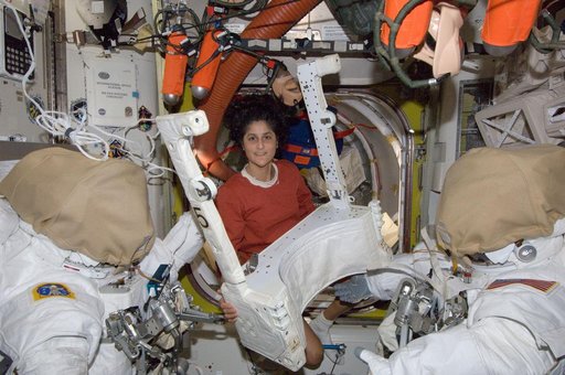 Williams in U.S. Airlock with EVA equipment