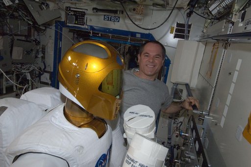 Ford takes a boxing pose with Robonuat 2 humanoid robot in the U.S. Laboratory