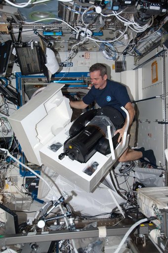 Hadfield prepares to set up the ISERV in the U.S. Laboratory
