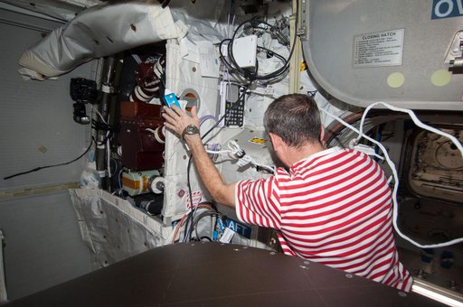 Hadfield removes the WTSM and installs the WOOV in the Columbus Module