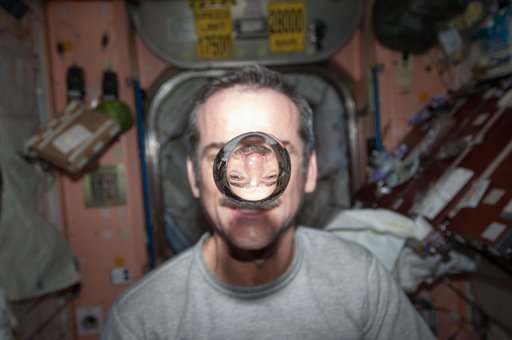 Hadfield watches a water bubble float freely in the Node 1