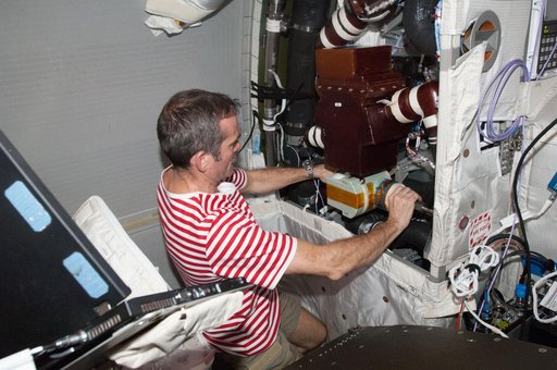 Hadfield removes the WTSM and installs the WOOV in the Columbus Module