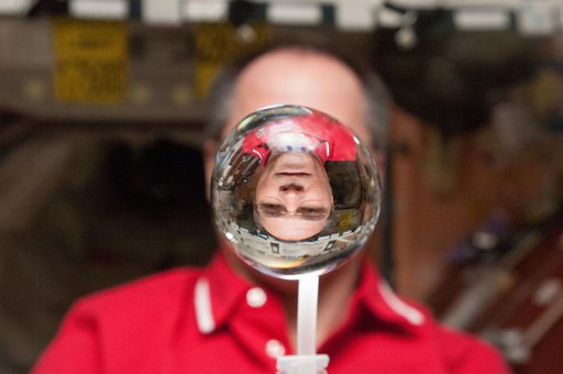 Ford watches a water bubble float in the Node 1