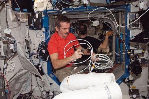 Hadfield works with Robonaut 2 hardware in the U.S. Laboratory