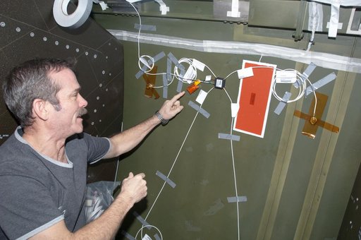 Hadfield installing UBNT Sensors in the U.S. Laboratory