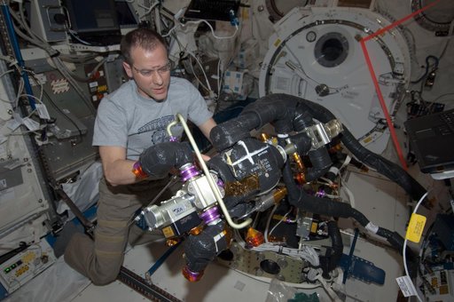 Marshburn performs maintenance on the CDRA in the JPM