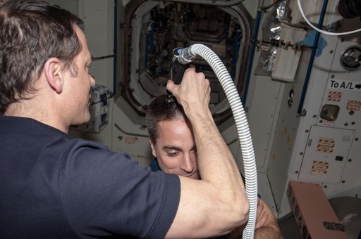 Marshburn gives Cassidy a haircut in Node 1