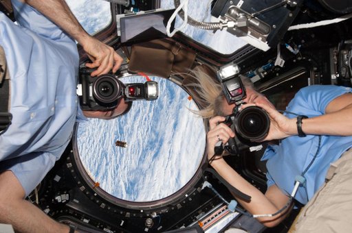 Cassidy and Nyberg in Cupola during HTV-4 approach