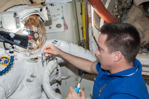 Cassidy in Quest airlock with malfunctioning EMU