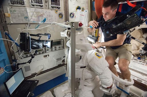 working in airlock on EMU repairs