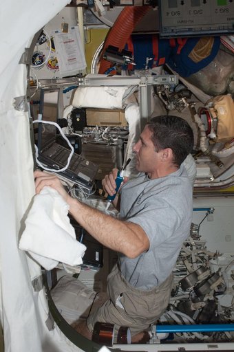 Hopkins at work in Quest airlock