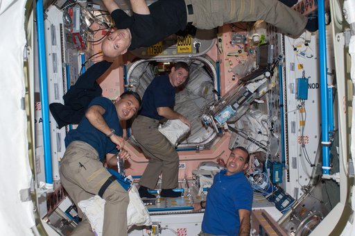 Crewmembers moving into Node 1 module
