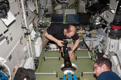 Kotov holds 400mm camera lens in the SM