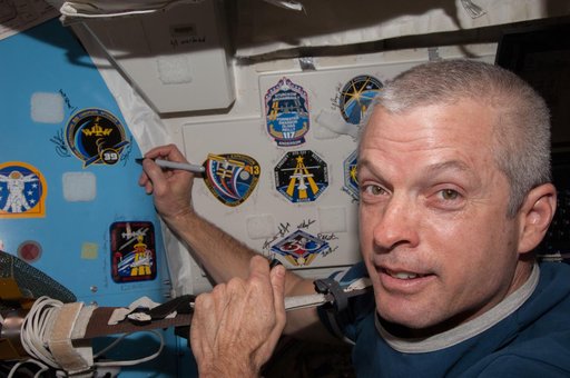 Swanson signs Mission Patch in A/L