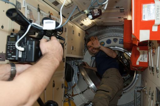 Crewmembers enter Soyuz TMA-11M Spacecraft