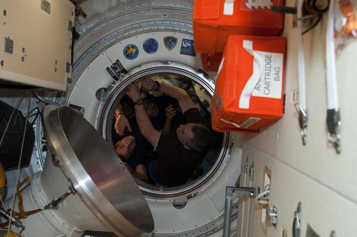 Crewmembers during Soyuz TMA-11M Hatch Closing