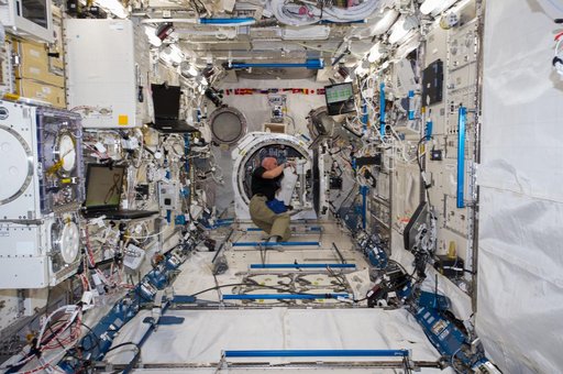 Gerst working on JEM airlock satellite deployer