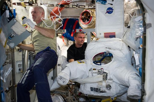 Swanson and Wiseman in Airlock with EMU