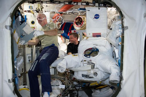 Swanson and Wiseman in Airlock with EMU