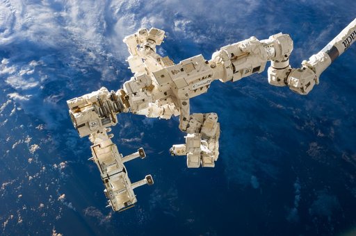 SPDM DEXTRE carrying the Rapidsat Instrument Assembly