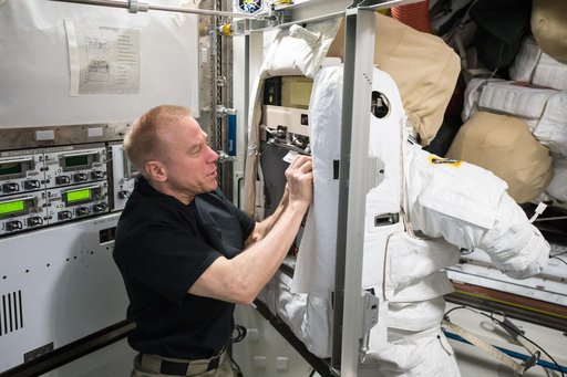 Kopra during EMU spacesuit for Cooling Loop Maintnenace