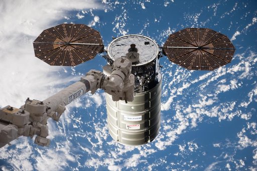 Cygnus space vehicle during capture by SSRMS