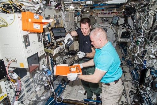 Pesquet and Novitskiy conduct JAXA PCG Canister Removal