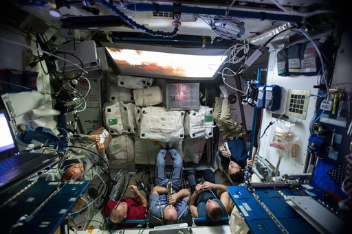Expedition 54 crew members watch a movie