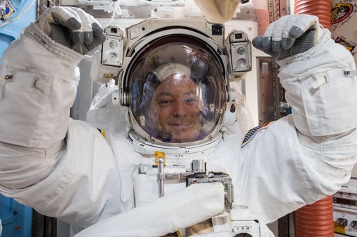 NASA astronaut Scott Tingle wears a U.S. spacesuit