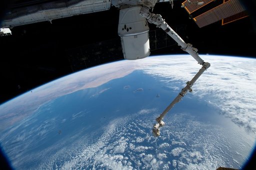 The SpaceX Dragon cargo craft and the Canadarm2 robotic arm