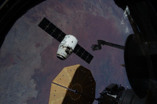 The SpaceX Dragon cargo craft begins its departure from the International Space Station