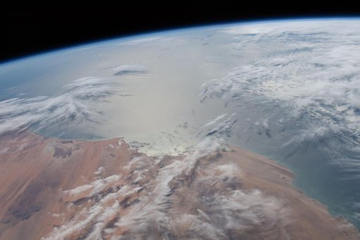 The Sun's glint radiates off the Atlantic Ocean