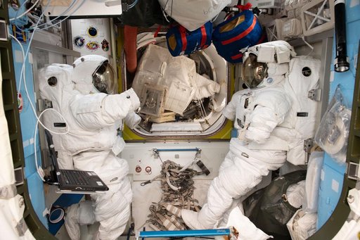 A pair of U.S. spacesuits inside the Quest airlock