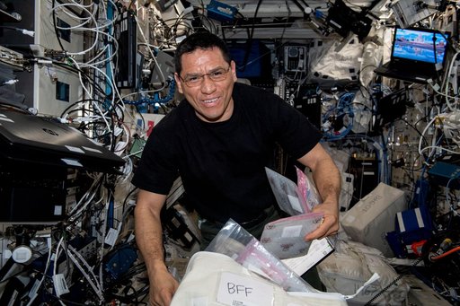 Astronaut Frank Rubio works on a 3D bioprinter