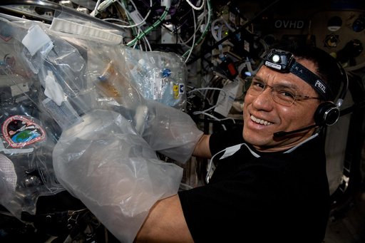 Astronaut Frank Rubio works on a 3D bioprinter