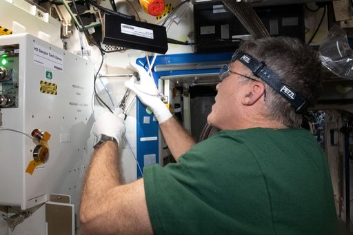 Astronaut Stephen Bowen installs the H2 Sensor Demo