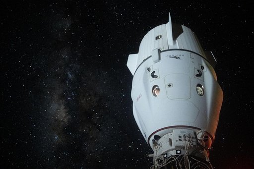 The Milky Way appears behind the SpaceX Dragon Endeavour