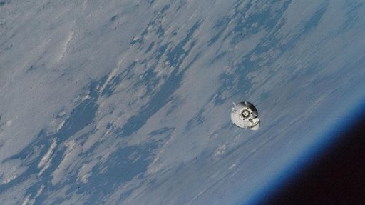The SpaceX Dragon Freedom approaches the station above Canada