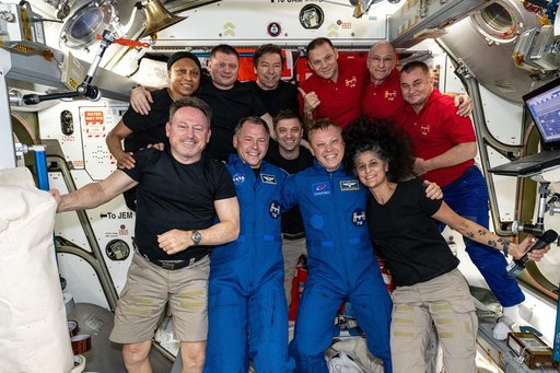 The 11-member Expedition 72 crew poses for a portrait