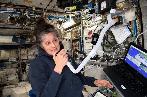 Astronaut Suni Williams calls down to students using a ham radio