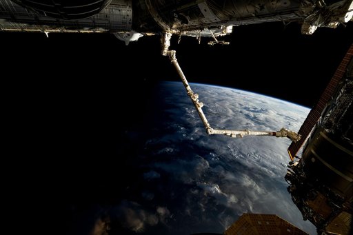 The 57.7-foot-long Candarm2 robotic arm extends from the Harmony module