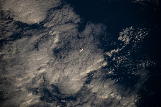 The SpaceX Dragon cargo spacecraft approaches the International Space Station